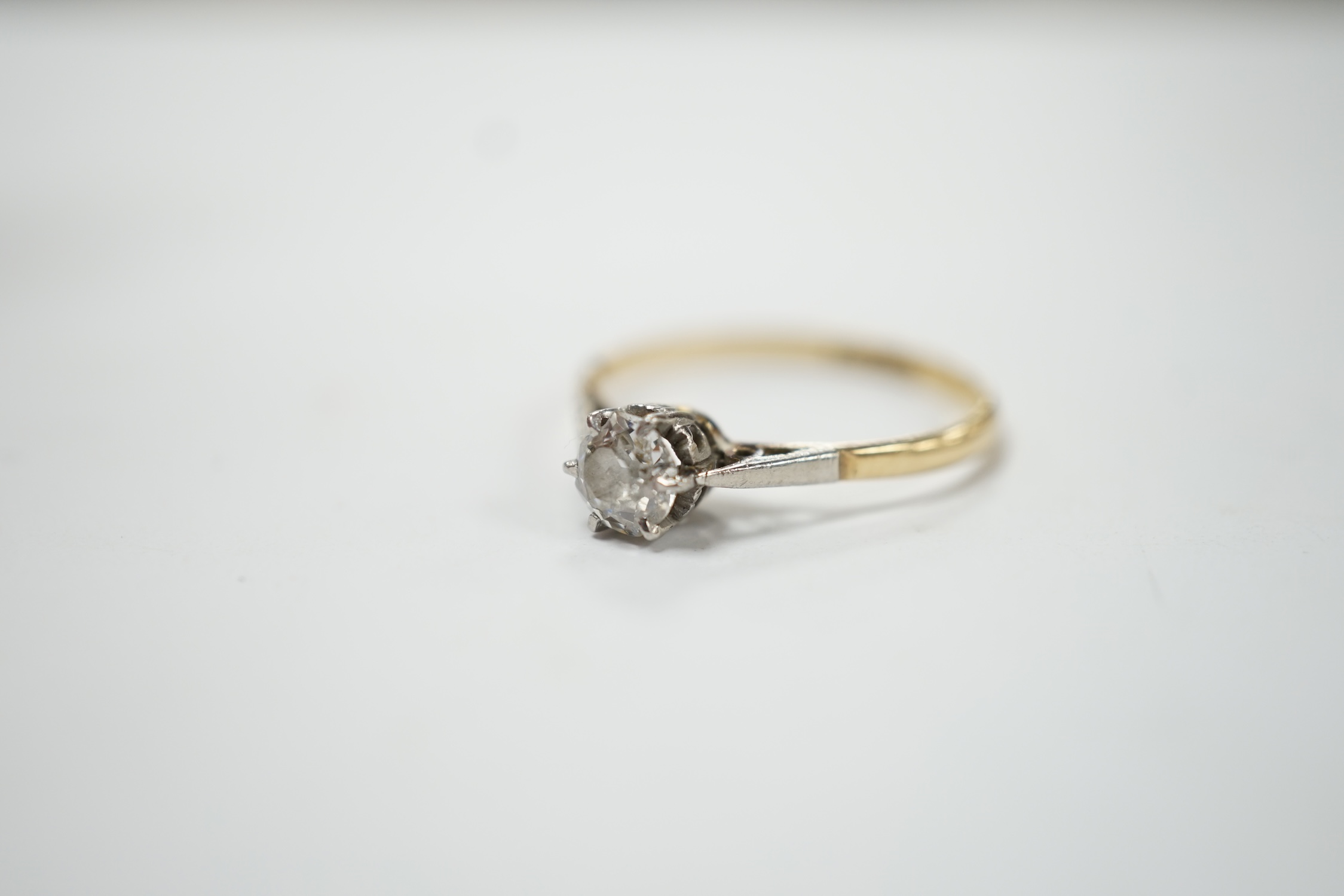 An 18ct, plat. and solitaire diamond set ring, size O, gross weight 1.7 grams. Fair condition.